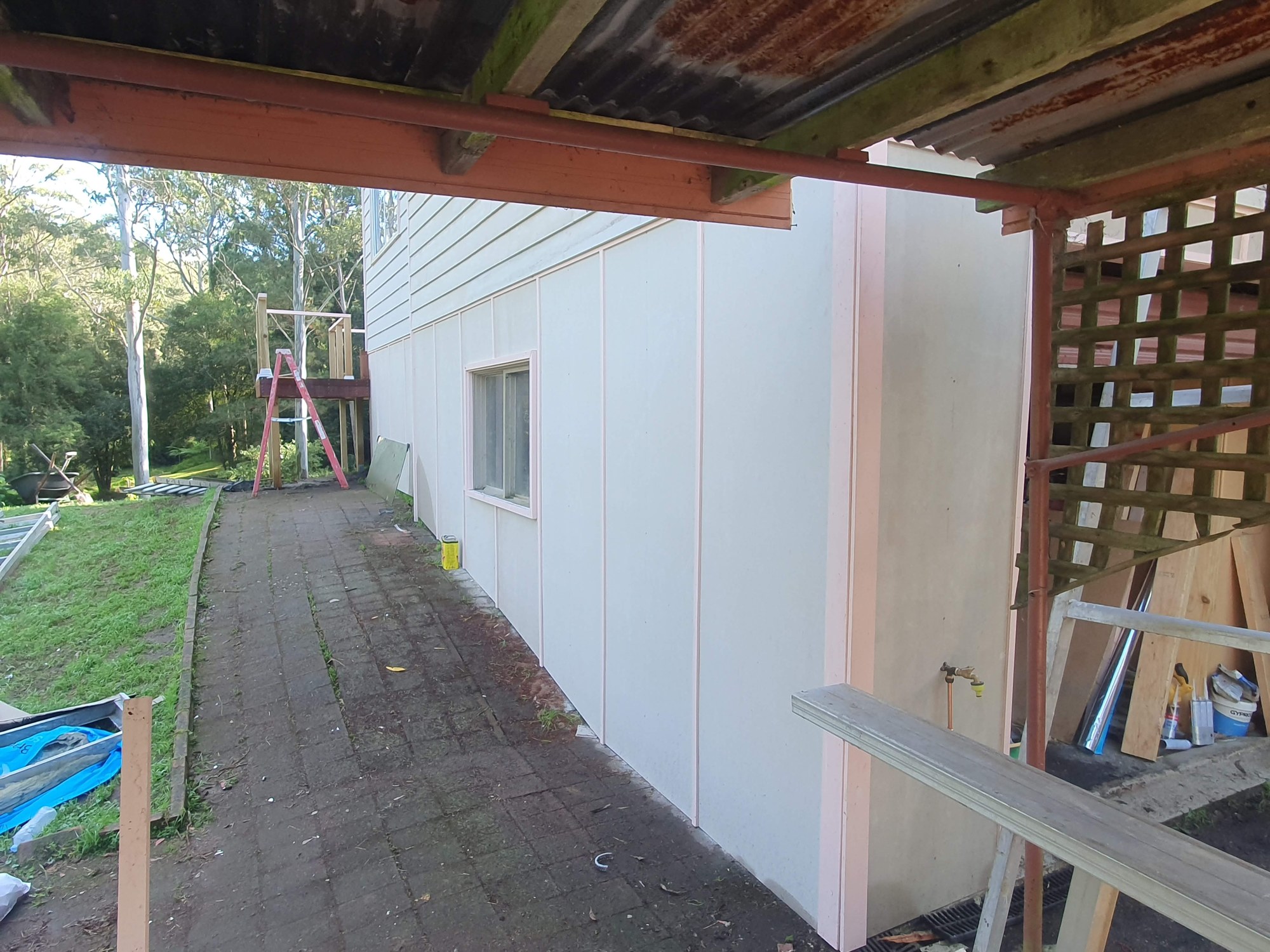 Holgate renovation — Exterior wall cladding and roof framing